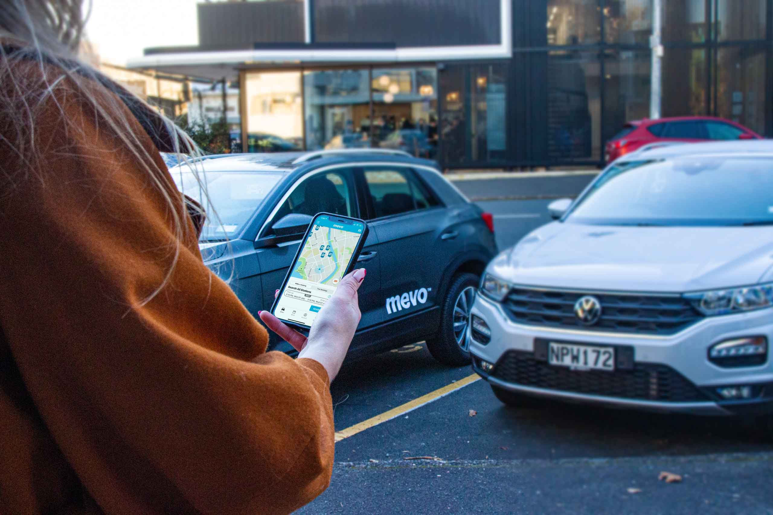 iPhone with the Mevo app displayed on screen